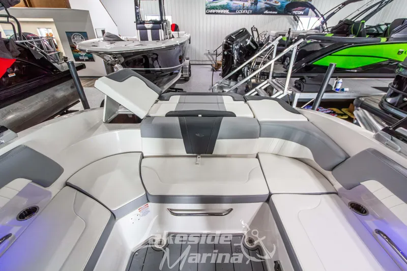 Slide: The Image of 2025 Chaparral 23 SSi boat interior with sleek seating and modern design. - 14