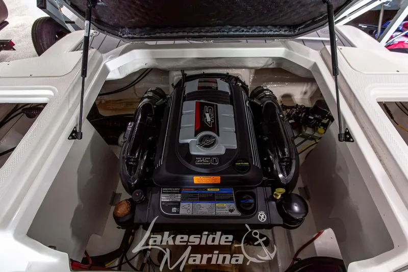 Slide: The Image of 2025 Chaparral 23 SSi boat engine compartment with Mercury 4.5L 250 HP engine. - 18