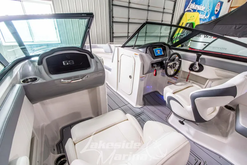 Slide: The Image of 2025 Chaparral 23 SSi boat interior with modern dashboard and seating. - 23