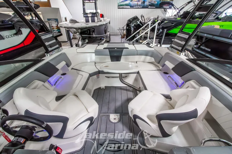 Slide: The Image of 2025 Chaparral 23 SSi boat interior with luxurious seating and modern design. - 28