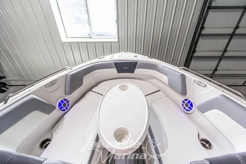 Slide: The Image of 2025 Chaparral 23 SSi boat interior with seating and blue LED speakers. - 30