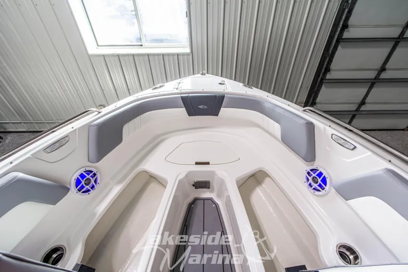 Slide: The Image of 2025 Chaparral 23 SSi boat interior with modern seating and blue LED speakers. - 31