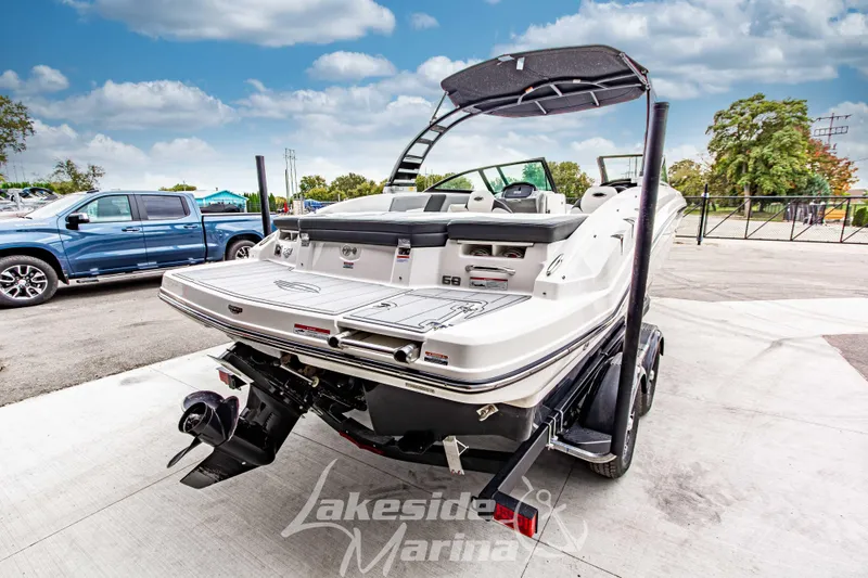 Slide: The Image of 2025 Chaparral 23 SSi boat at Lakeside Marina, rear view with trailer. - 4