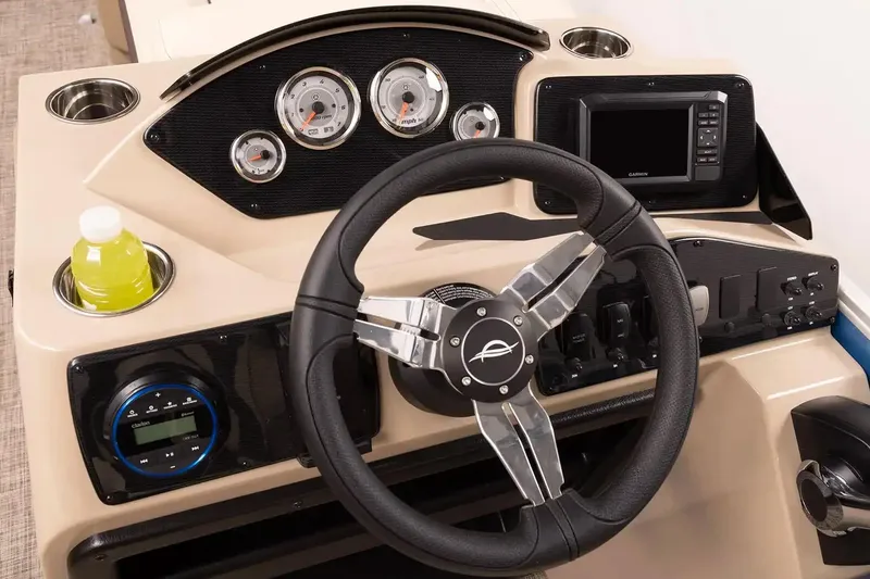 Slide: The Image of Manufacturer Provided Image: 2026 SunCatcher Select 20C boat dashboard with steering wheel, gauges, and navigation system. - 12