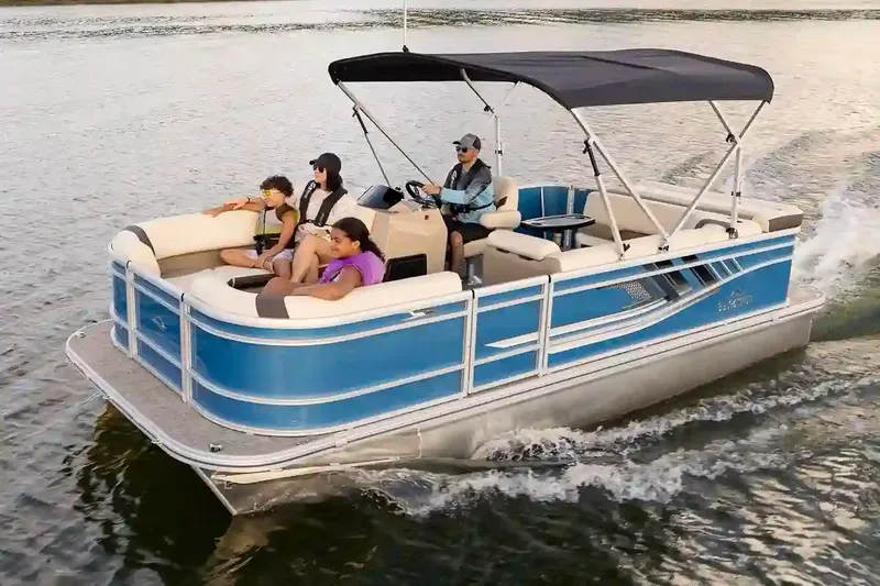Slide: The Image of Manufacturer Provided Image: 2026 SunCatcher Select 20C pontoon boat cruising with passengers on a calm lake. - 3