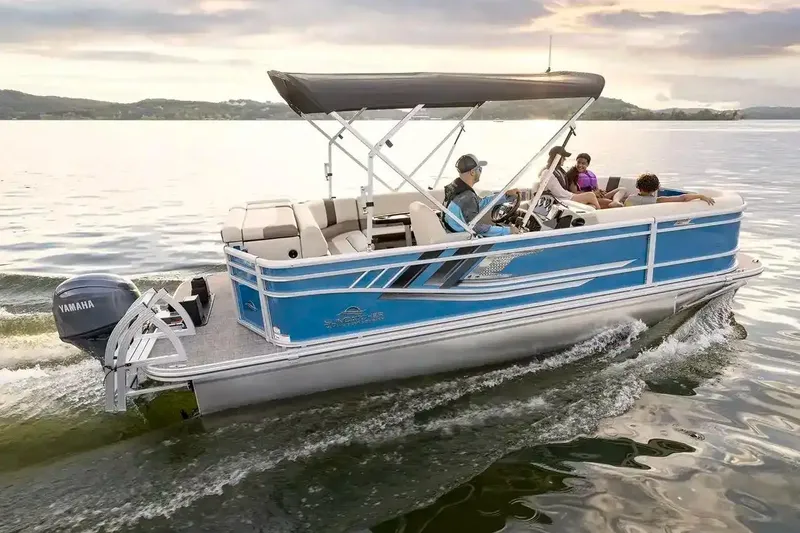 Slide: The Image of Manufacturer Provided Image: 2026 SunCatcher Select 20C pontoon boat cruising on a serene lake at sunset. - 8