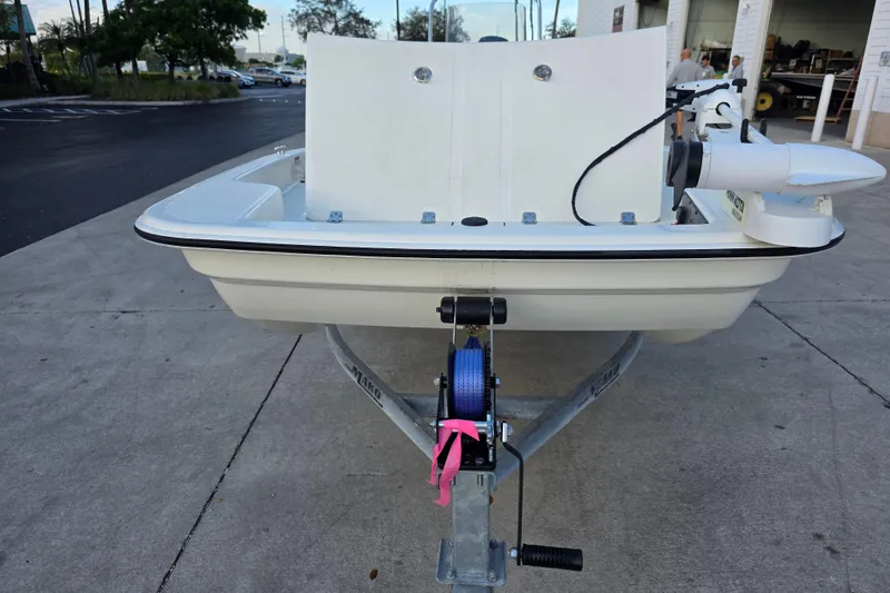 Slide: The Image of 2022 Mako Pro Skiff 15 CC boat on trailer, parked outdoors. - 7