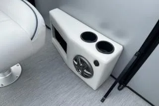 Slide: The Image of 2026 Sweetwater 2286SFLC boat interior with cup holders and speaker. - 16