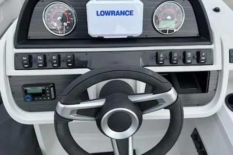 Slide: The Image of Steering console of 2026 Sweetwater 2286SFLC boat with Lowrance display and gauges. - 21