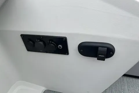 Slide: The Image of Control panel and Garmin mount on 2026 Sweetwater 2286SFLC boat interior. - 23