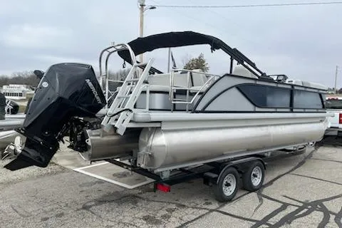 Slide: The Image of 2026 Sweetwater 2286SFLC pontoon boat on trailer, featuring a powerful outboard motor. - 25