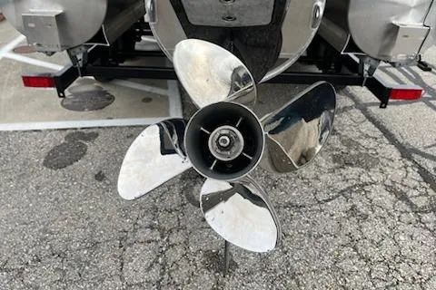 Slide: The Image of Propeller of 2026 Sweetwater 2286SFLC boat on pavement background. - 26