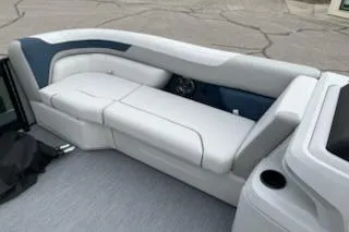 Slide: The Image of 2026 Sweetwater 2286SFLC boat interior with sleek white seating and modern design. - 6