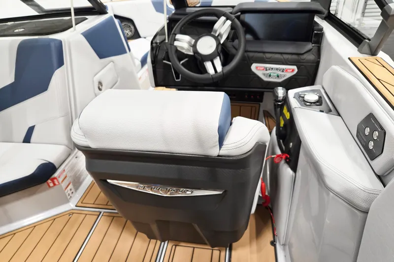 Slide: The Image of 2026 Nautique Super Air Nautique GS20 boat interior with modern dashboard and seating. - 7