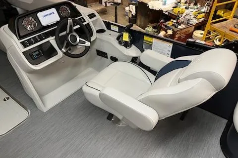 Slide: The Image of 2026 Sweetwater 2286SFL boat interior with modern steering console and comfortable captain's chair. - 14