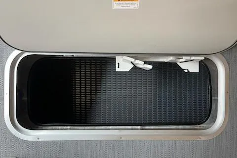 Slide: The Image of Storage compartment of 2026 Sweetwater 2286SFL boat, featuring a secure latch system. - 16