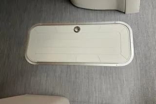 Slide: The Image of 2026 Sweetwater 2286SFL boat floor hatch on textured surface. - 17