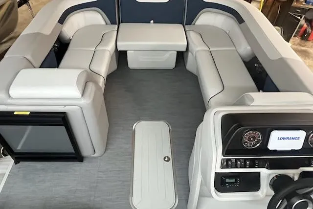 Slide: The Image of Interior of 2026 Sweetwater 2286SFL pontoon boat with plush seating and modern dashboard. - 19