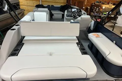 Slide: The Image of 2026 Sweetwater 2286SFL boat interior with white seating and modern dashboard. - 7