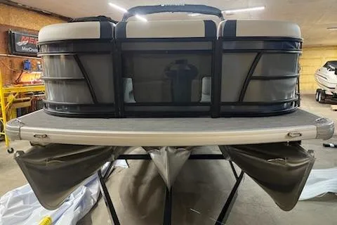 Slide: The Image of 2026 Sweetwater 2286SFL pontoon boat in a garage setting. - 8