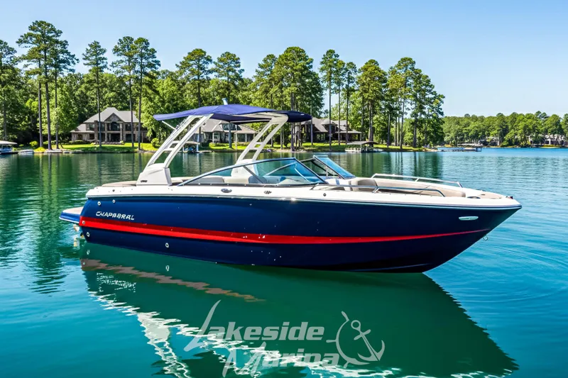 The Image of 2025 Chaparral 247 SSX boat on a serene lake with lush green surroundings. - 0