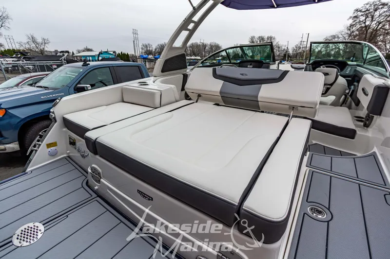 Slide: The Image of 2025 Chaparral 247 SSX boat with luxurious seating and modern design at Lakeside Marina. - 11