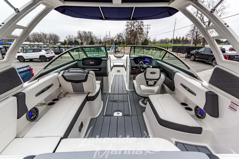 Slide: The Image of 2025 Chaparral 247 SSX boat interior with luxurious seating and modern dashboard. - 12