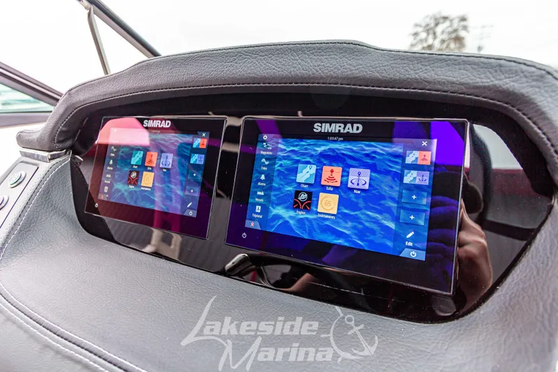 Slide: The Image of 2025 Chaparral 247 SSX dashboard with dual Simrad displays at Lakeside Marina. - 20