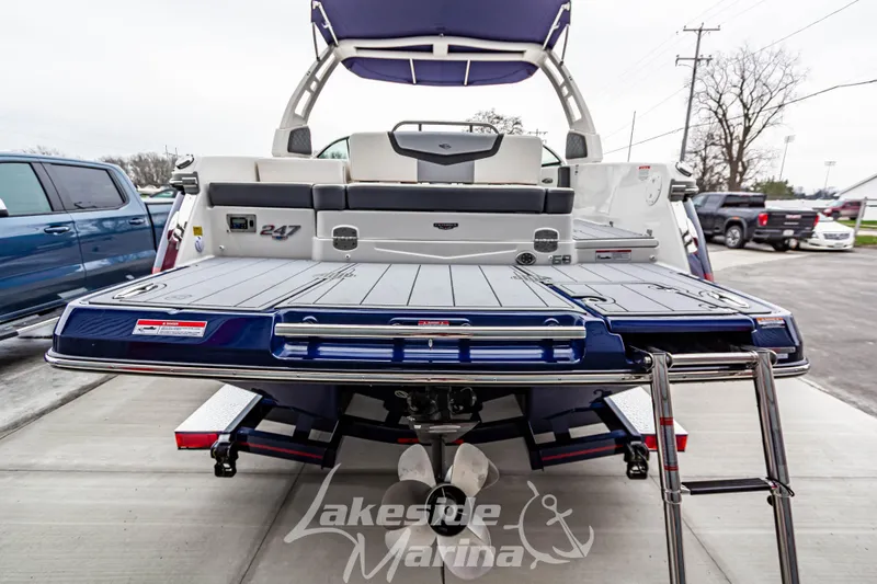 Slide: The Image of 2025 Chaparral 247 SSX boat rear view with swim platform and ladder at Lakeside Marina. - 5