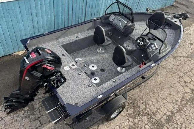 Slide: The Image of 2025 Tracker Pro Guide V-175 WT boat with motor, gray interior. - 5