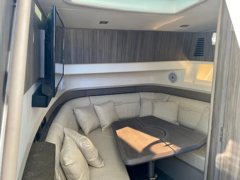 Slide: The Image of Interior of 2021 Sea Ray SLX 400 Outboard with cozy seating area. - 14