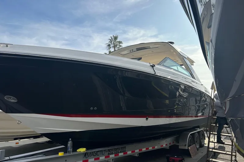 Slide: The Image of 2021 Sea Ray SLX 400 Outboard on a trailer. - 18
