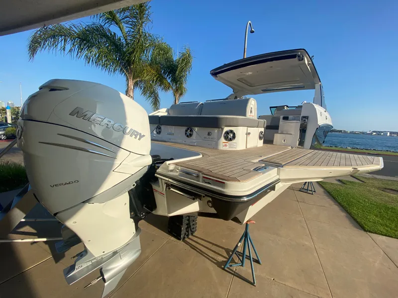 Slide: The Image of 2021 Sea Ray SLX 400 Outboard with Mercury engine by the water. - 3