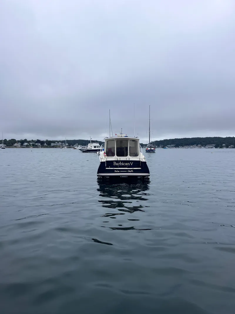 Slide: The Image of 2014 MJM 36z Downeast boat on calm water, overcast sky. - 15