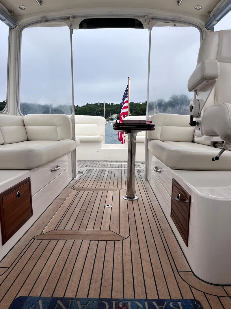 Slide: The Image of 2014 MJM 36z Downeast boat interior with teak flooring and American flag. - 39