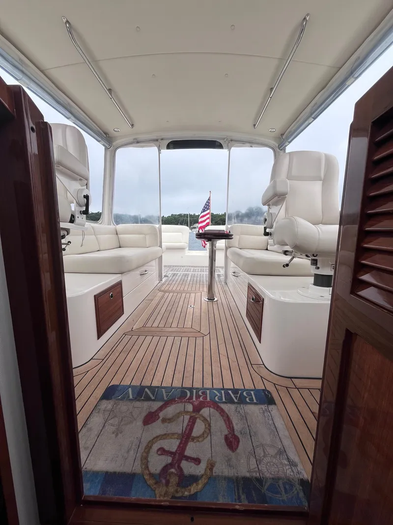 Slide: The Image of Interior view of 2014 MJM 36z Downeast yacht with elegant seating and American flag. - 41