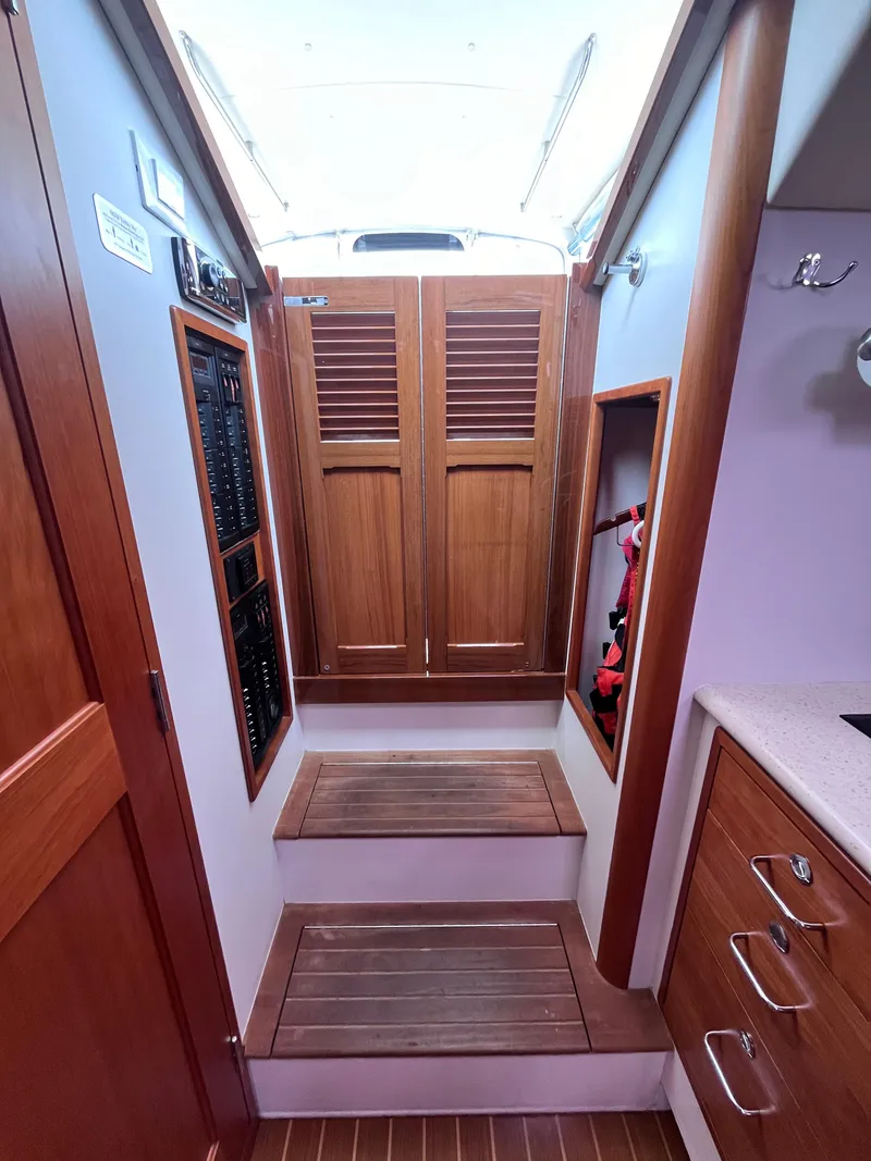 Slide: The Image of 2014 MJM 36z Downeast yacht interior with wooden cabinetry and steps. - 42