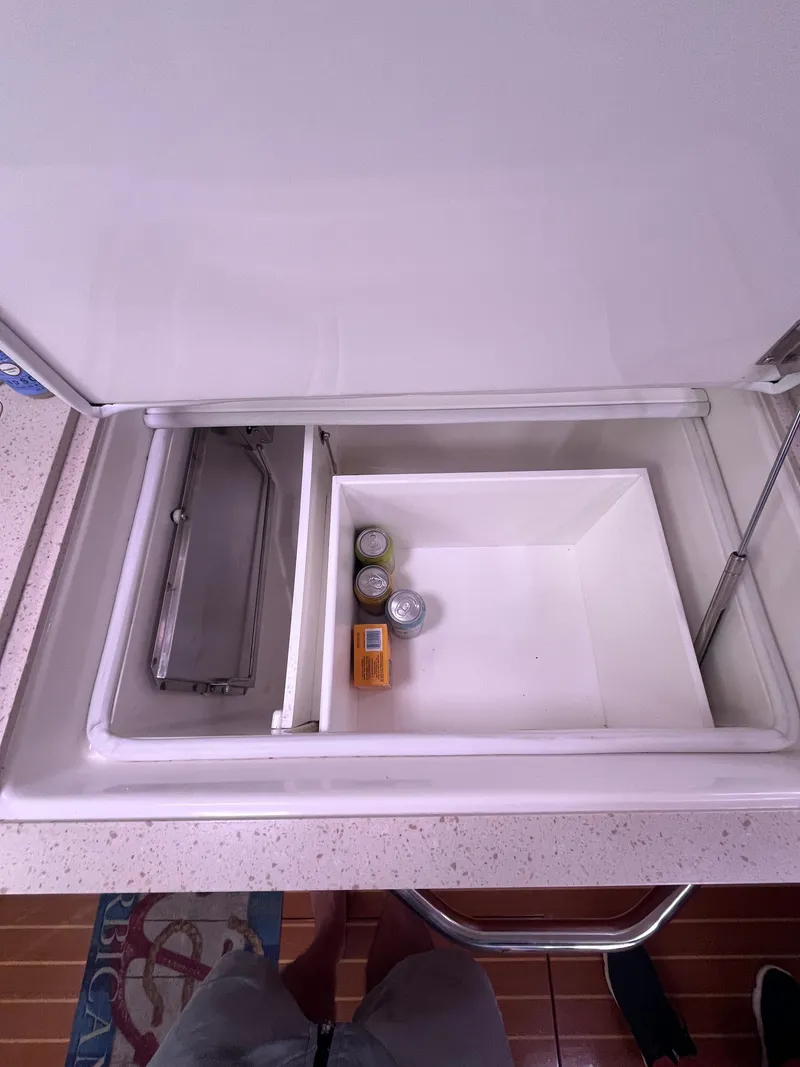 Slide: The Image of Open cooler compartment on 2014 MJM 36z Downeast boat with drinks and snacks. - 45