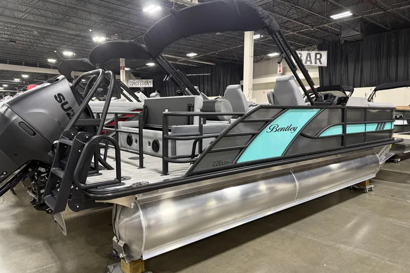 Slide: The Image of 2026 Bentley Pontoons 223 Swingback Dual Capt pontoon boat displayed indoors. - 2