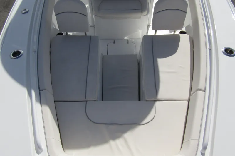 Slide: The Image of 2025 Sea Hunt Ultra 275 SE boat interior with cushioned seating. - 11