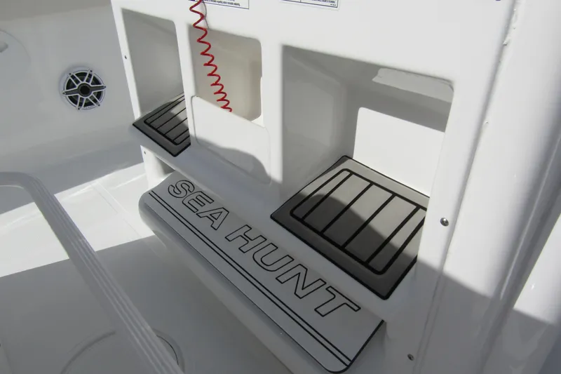 Slide: The Image of 2025 Sea Hunt Ultra 275 SE boat interior with branded step and speaker. - 30
