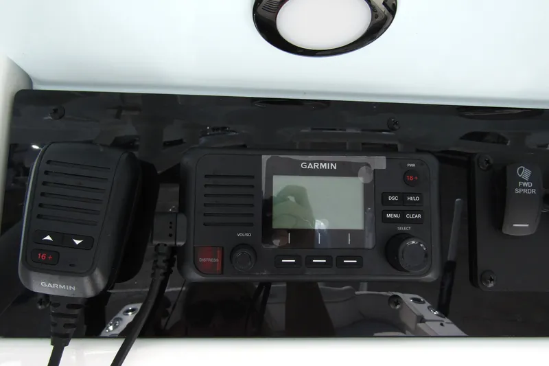 Slide: The Image of Garmin marine radio system on 2025 Sea Hunt Ultra 275 SE boat dashboard. - 31