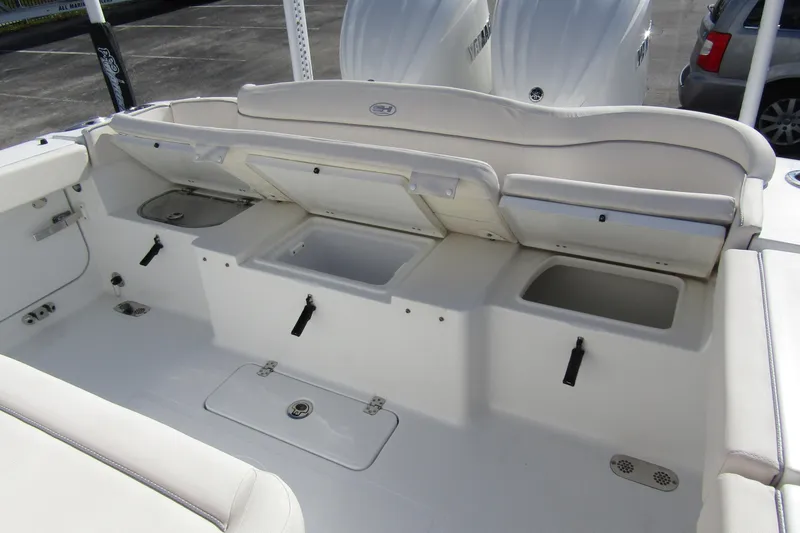 Slide: The Image of 2025 Sea Hunt Ultra 275 SE boat interior with storage compartments open. - 38