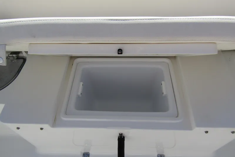 Slide: The Image of Open storage compartment on 2025 Sea Hunt Ultra 275 SE boat. - 40