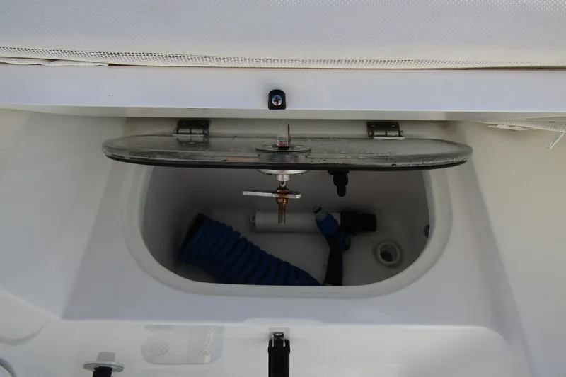 Slide: The Image of Open storage compartment on 2025 Sea Hunt Ultra 275 SE boat. - 41