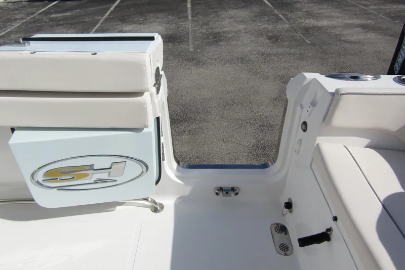 Slide: The Image of 2025 Sea Hunt Ultra 275 SE boat interior with seating and logo detail. - 42