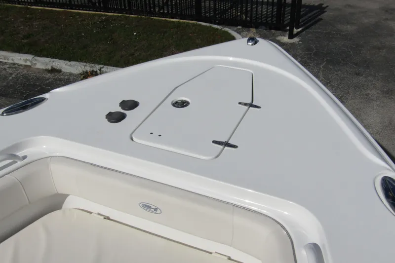 Slide: The Image of 2025 Sea Hunt Ultra 275 SE boat bow with storage compartment and seating. - 9