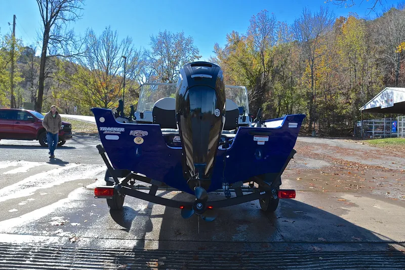 Slide: The Image of 2017 Tracker Pro Guide V-16 WT boat on trailer at scenic outdoor location. - 13