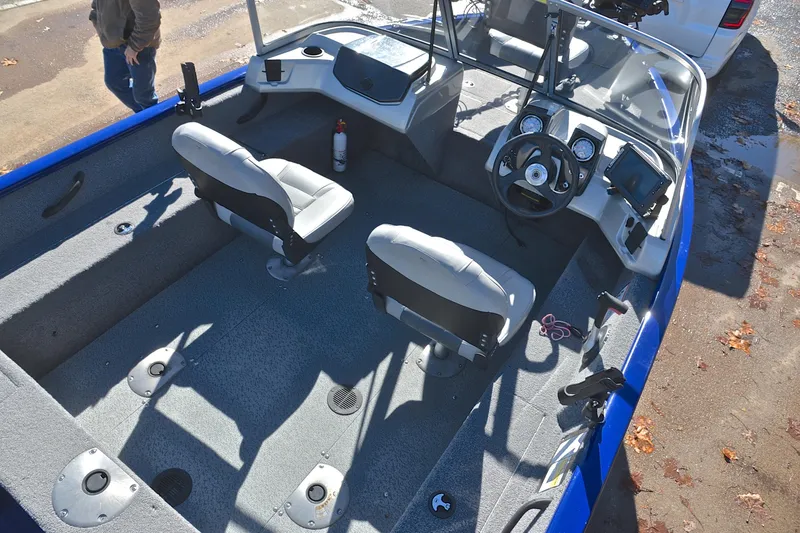 Slide: The Image of 2017 Tracker Pro Guide V-16 WT boat interior with dual seats and steering console. - 20