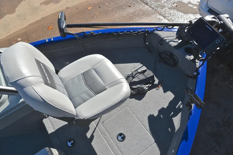 Slide: The Image of 2017 Tracker Pro Guide V-16 WT boat interior with seat and fishing equipment. - 21